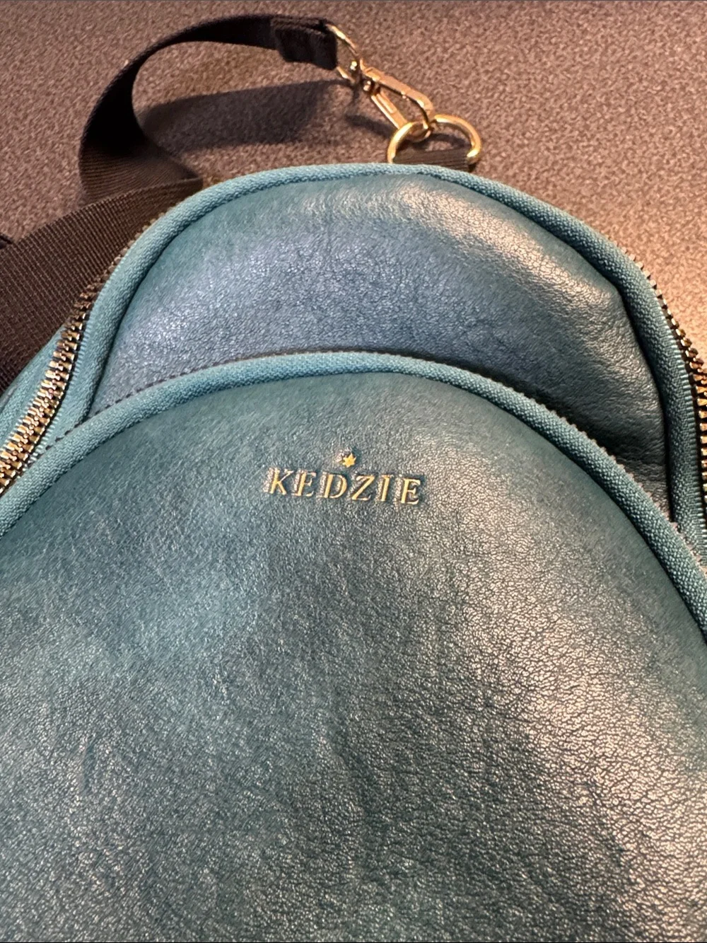 Kedzie Sunset sling bag in teal